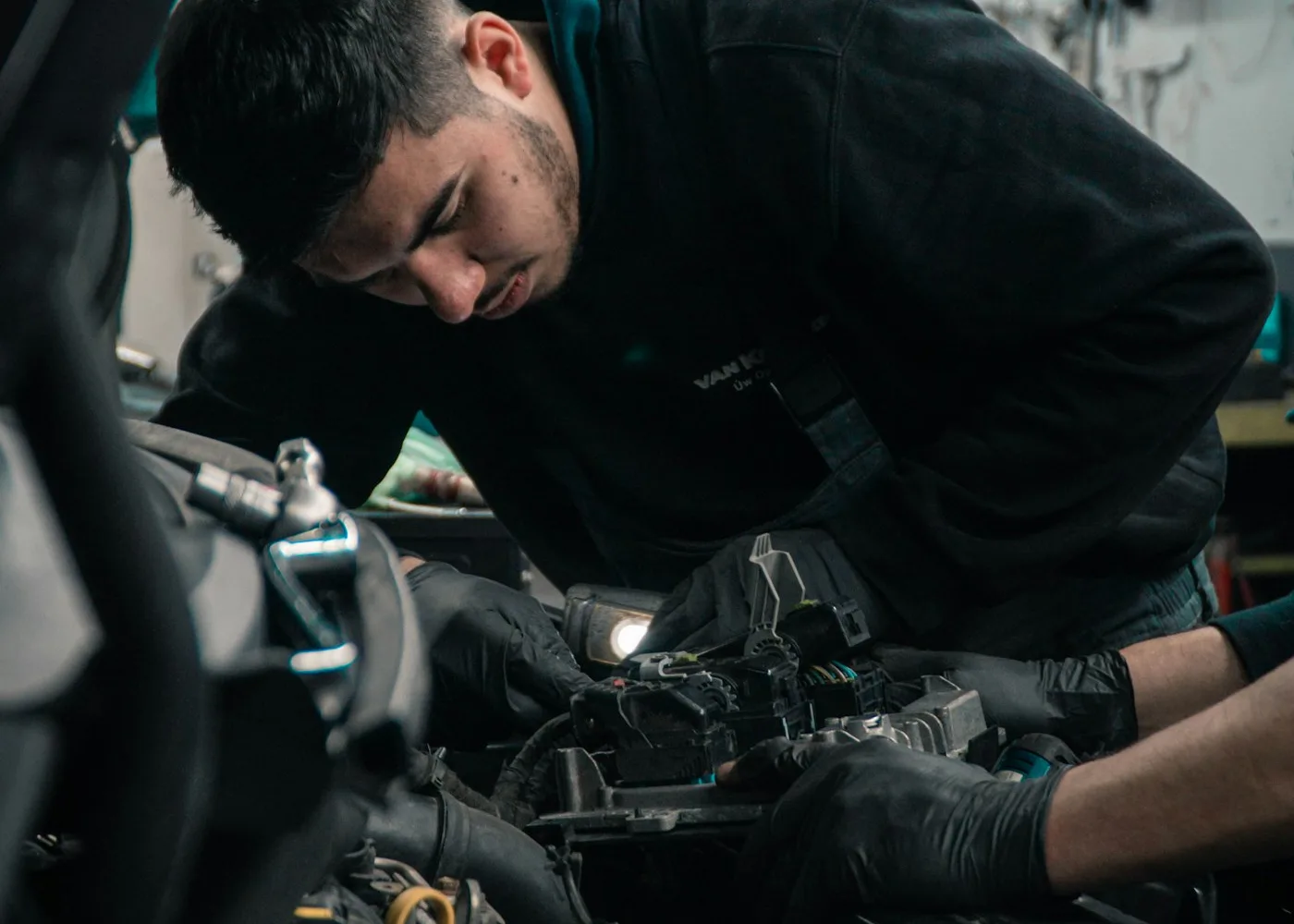 Technician diagnosing and repairing a generator engine with a work light in Rockland County, NY