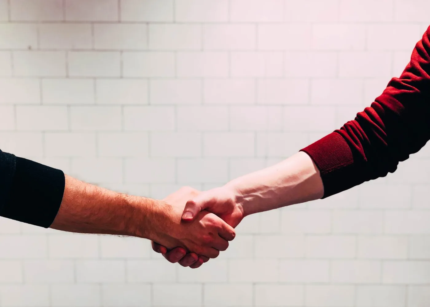 Homeowner and Generac service technician shaking hands on a maintenance plan in Rockland County, NY